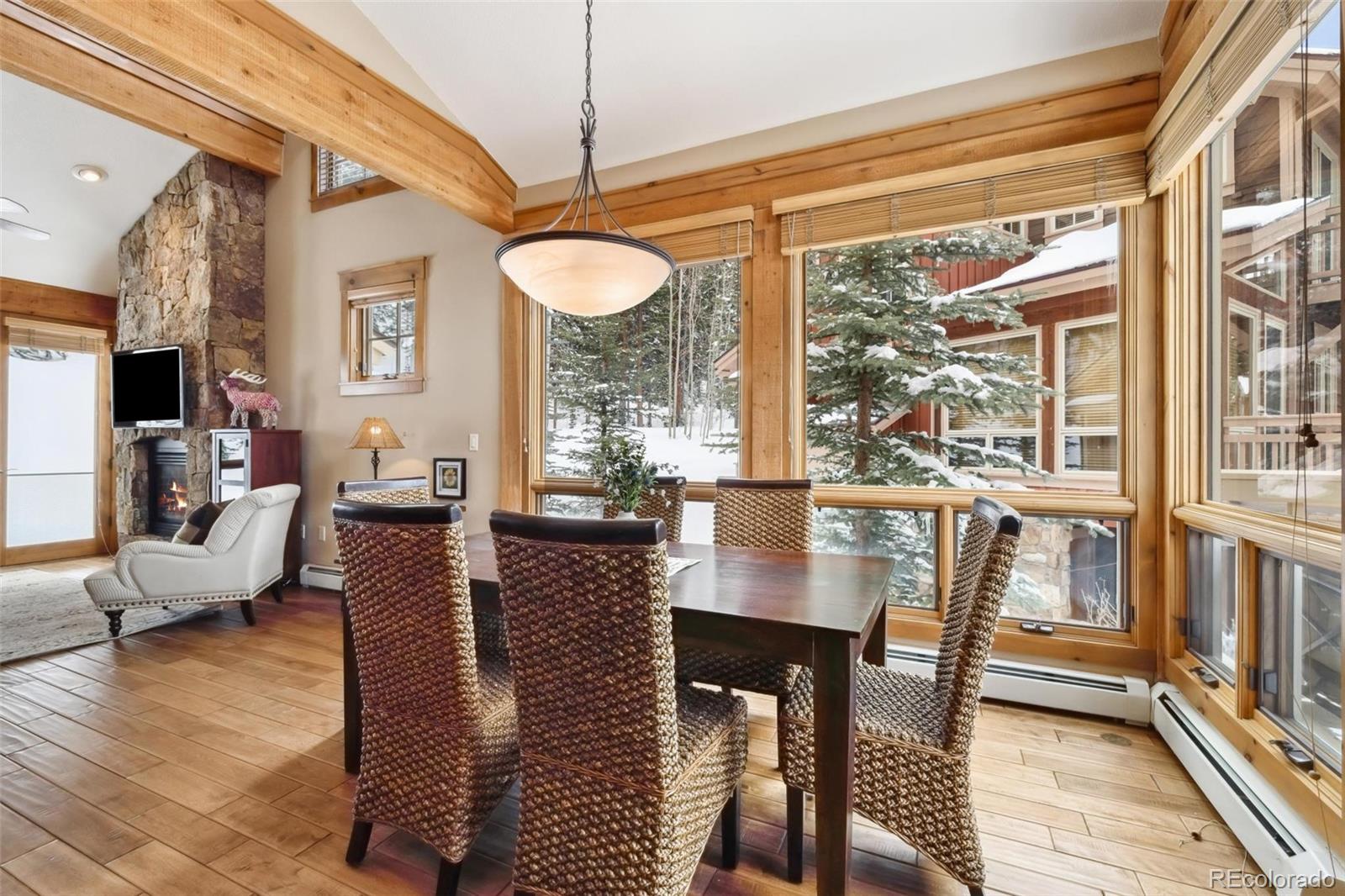 129 Tip Top Trail, Unit 6543 Dillon, CO 80435 - Photo 9 of 40 a view of a dining room with furniture window and wooden floor