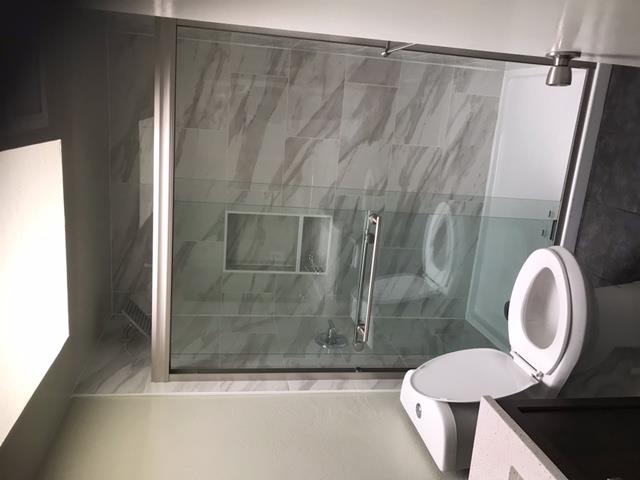 28 Houston Street San Francisco, CA 94133 - Photo 12 of 32 a bathroom with a sink and a mirror