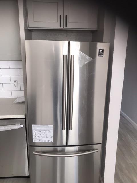 28 Houston Street San Francisco, CA 94133 - Photo 19 of 32 a view of a refrigerator in kitchen and an empty room
