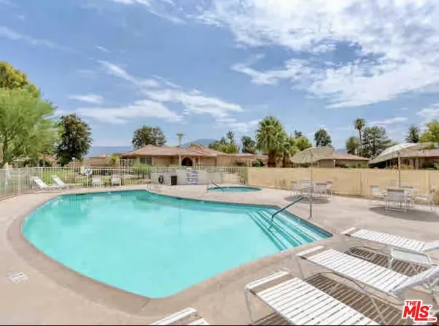 a view of a swimming pool with an ocean view