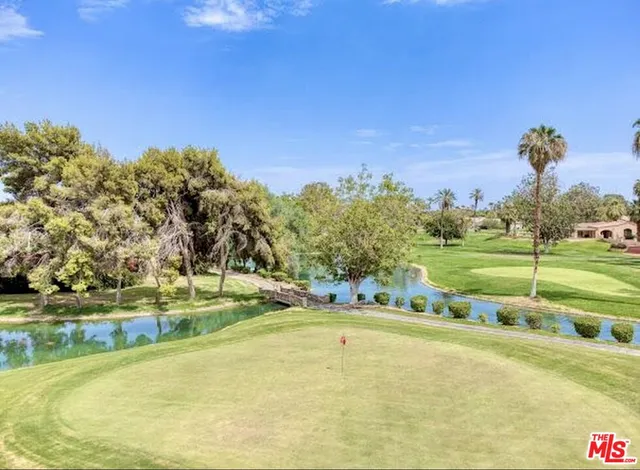 a view of a swimming pool with an outdoor space and seating area