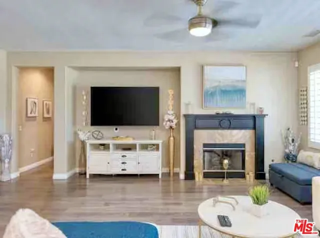 a living room with furniture fireplace and flat screen tv