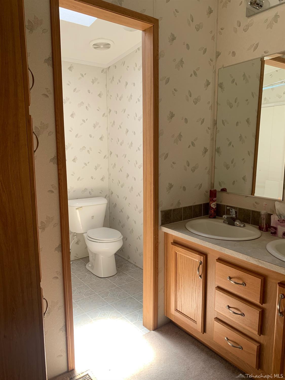 24401 Roper Street Tehachapi, CA 93561 - Photo 38 of 40 hallway bathroom