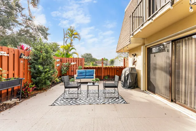 a view of a chairs and tables in the balcony