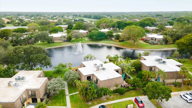 a aerial view of a house with a lake view
