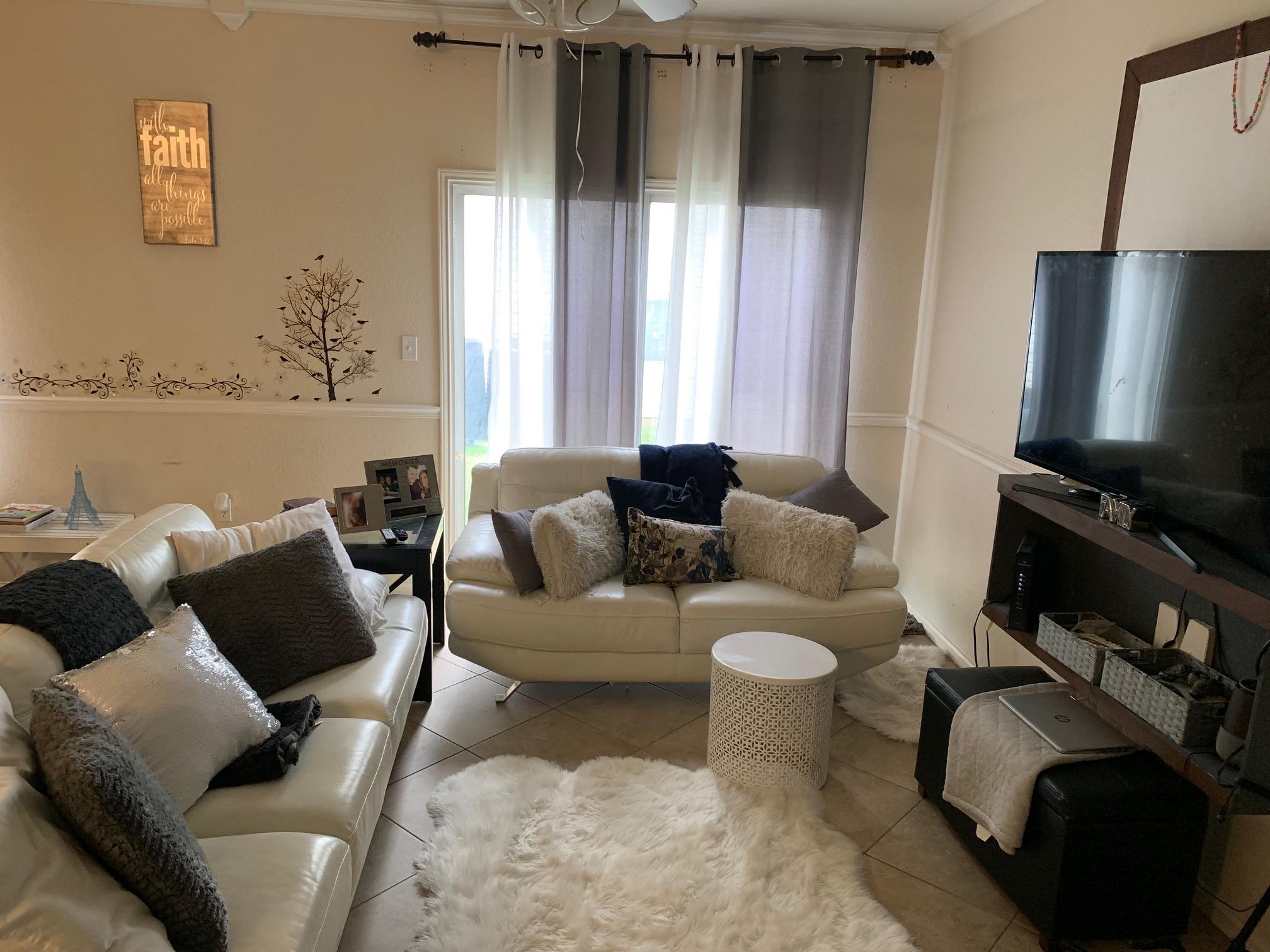 1014 Airport Road, Unit 114 Destin, FL 32541 - Photo 2 of 15 a living room with furniture and a flat screen tv