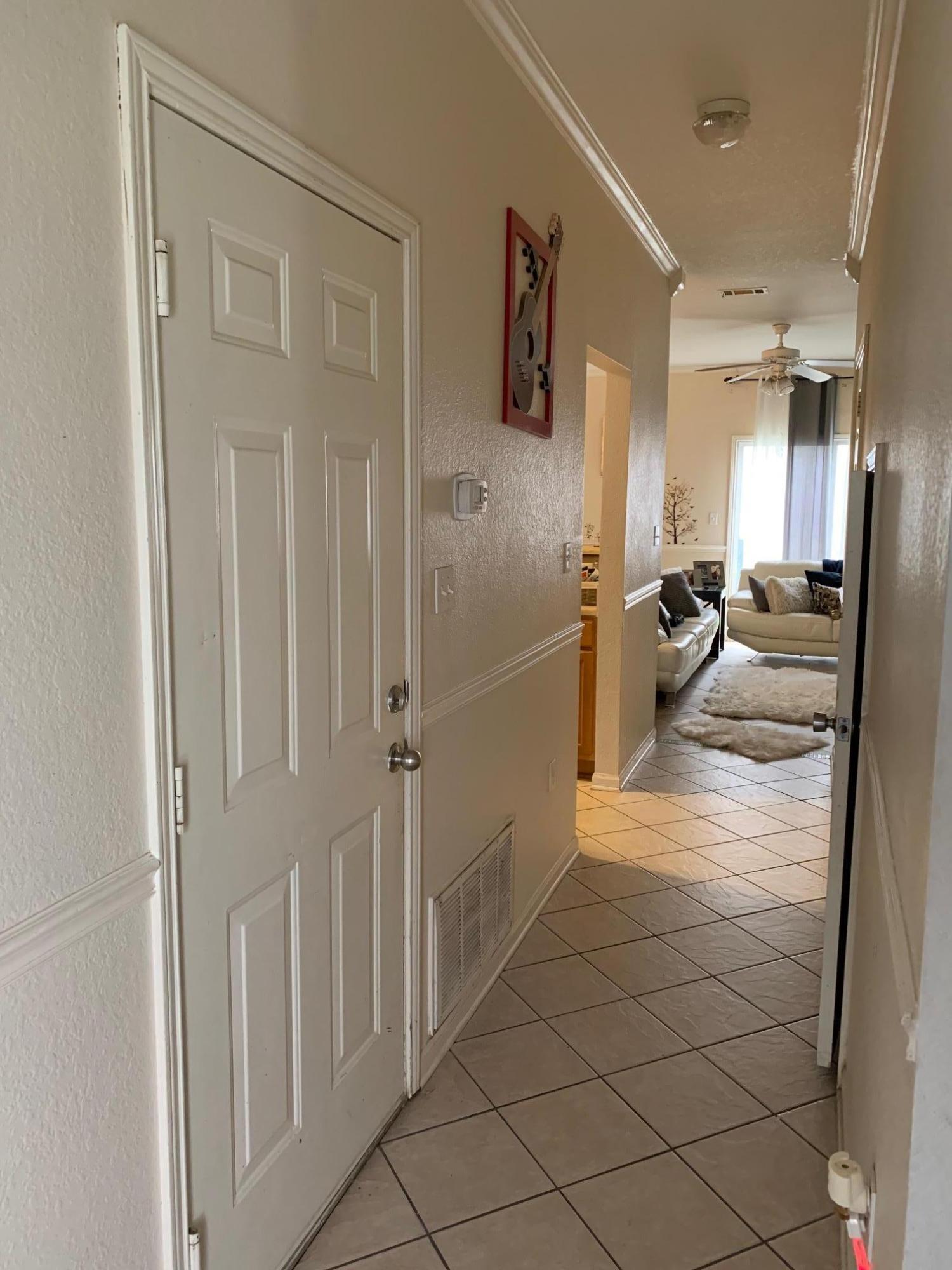 1014 Airport Road, Unit 114 Destin, FL 32541 - Photo 6 of 15 a hallway with white doors