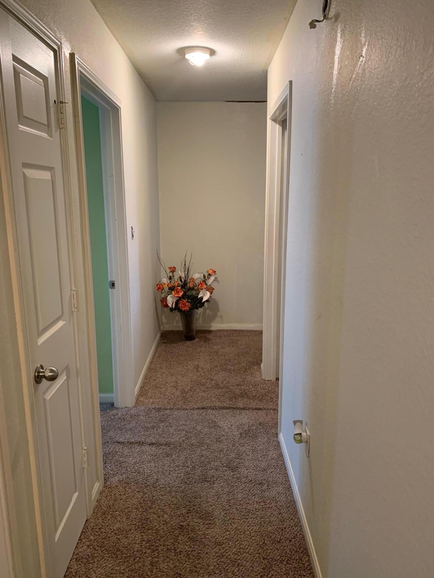 1014 Airport Road, Unit 114 Destin, FL 32541 - Photo 7 of 15 a view of a hallway and a livingroom with furniture