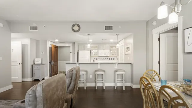 an aerial view of multiple houses with yard