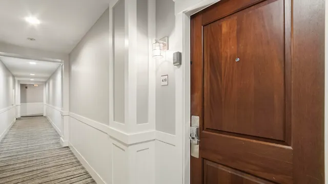 a bathroom with a sink and a stove a mirror