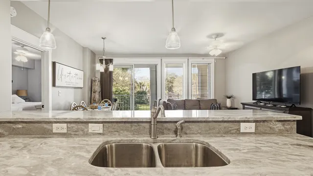 a bedroom with a large bed and a flat tv screen on a dresser