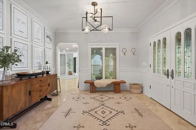 a dining room with furniture a window and kitchen view
