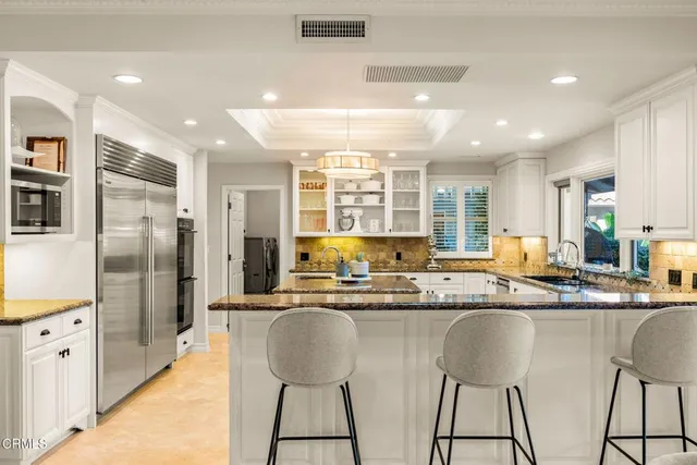 a swimming pool with outdoor seating and yard