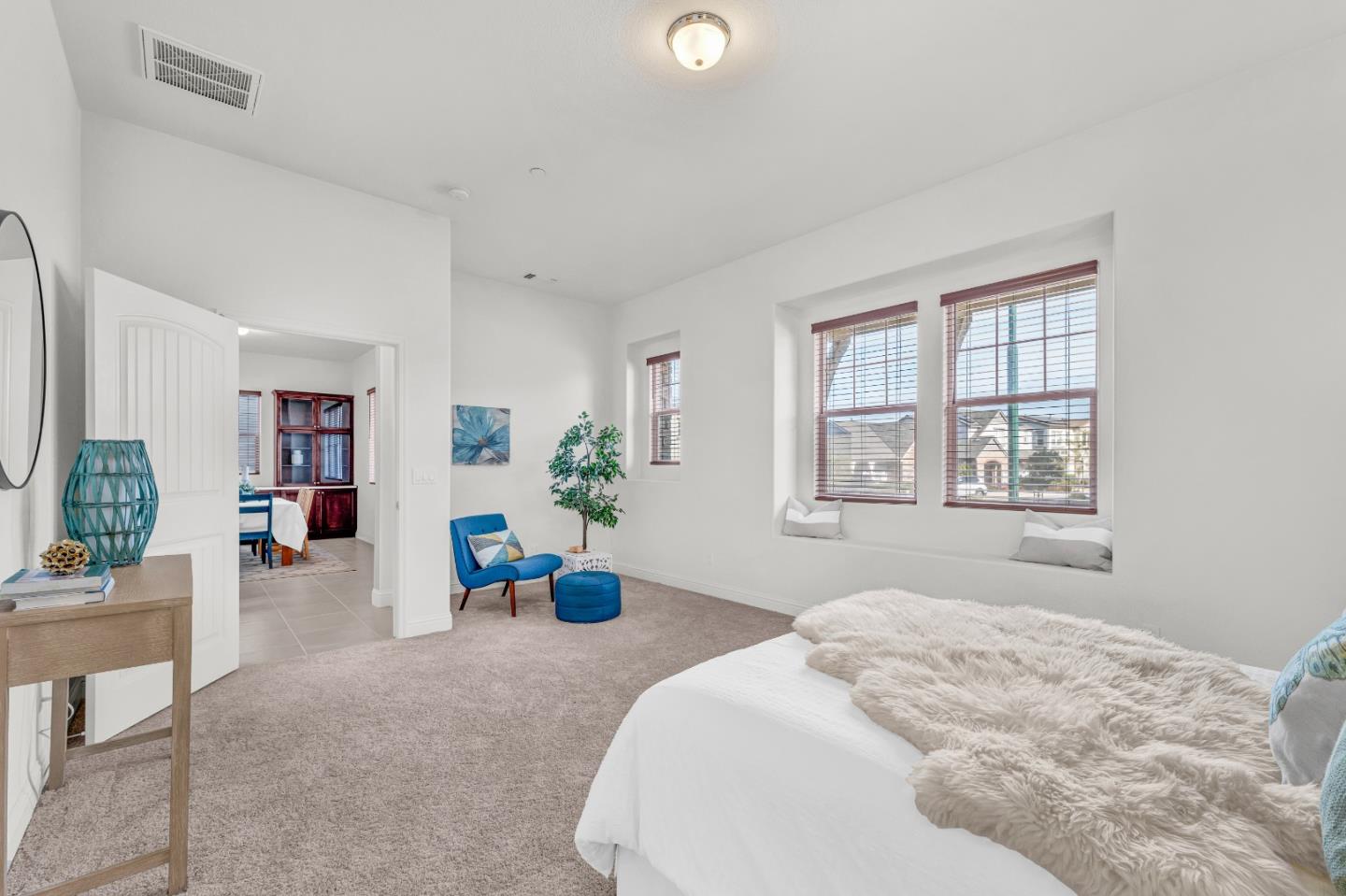 482 Lassen Way Marina, CA 93933 - Photo 16 of 45 a bedroom with a bed and potted plant next to a window