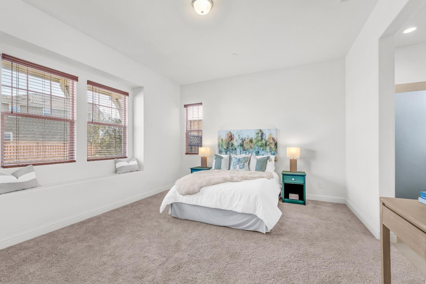482 Lassen Way Marina, CA 93933 - Photo 17 of 45 a spacious bedroom with a bed and a large window