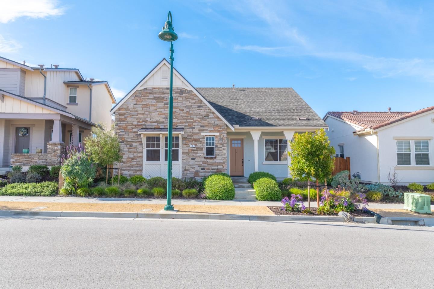 482 Lassen Way Marina, CA 93933 - Photo 2 of 45 a front view of a house with a yard and potted plants