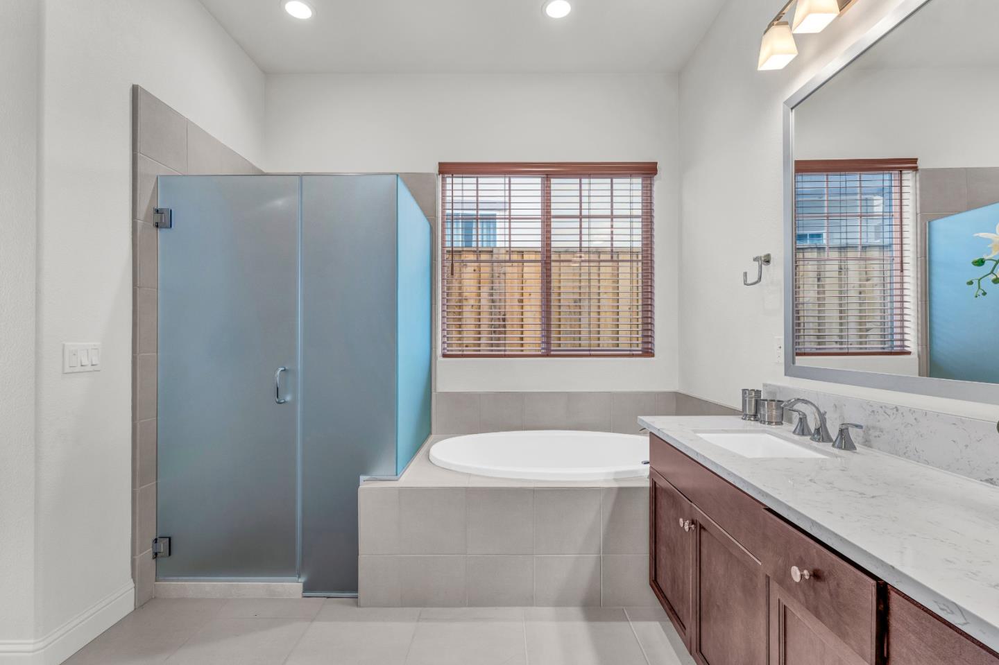482 Lassen Way Marina, CA 93933 - Photo 21 of 45 a bathroom with a tub sink and mirror
