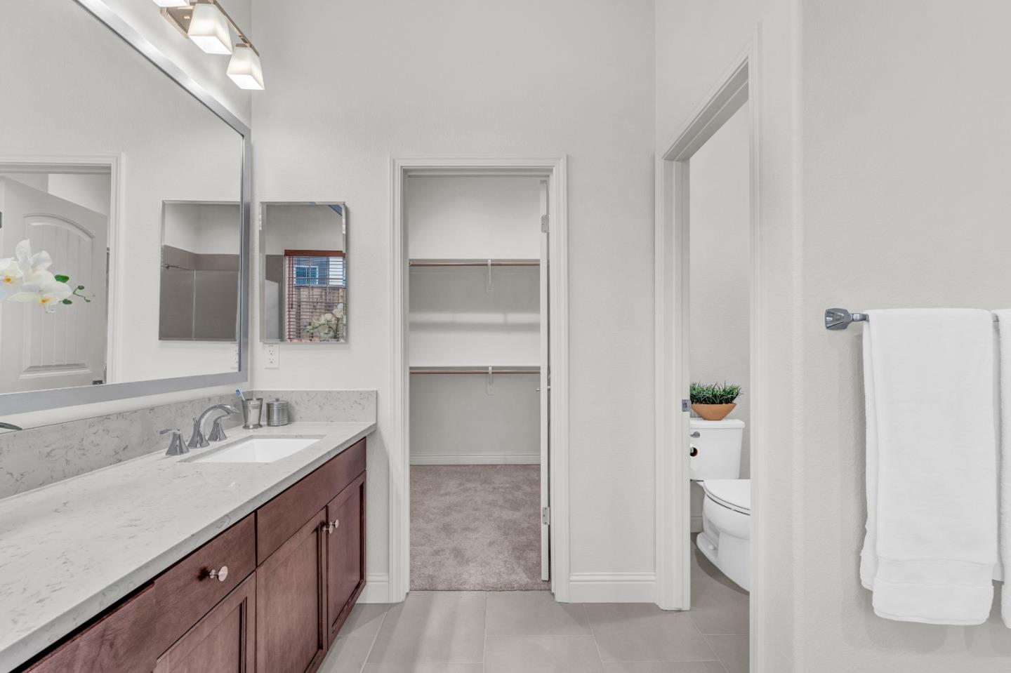 482 Lassen Way Marina, CA 93933 - Photo 22 of 45 a bathroom with a granite countertop sink and a mirror