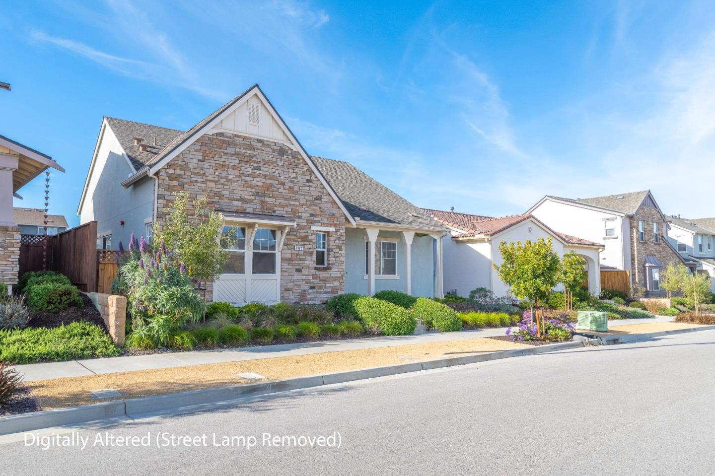 482 Lassen Way Marina, CA 93933 - Photo 3 of 45 a front view of a house with a yard and potted plants