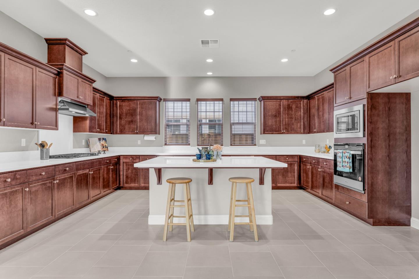 482 Lassen Way Marina, CA 93933 - Photo 9 of 45 a kitchen with stainless steel appliances granite countertop a table chairs sink refrigerator and cabinets