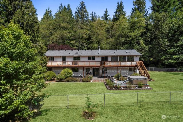 a view of a house with a yard deck and living room