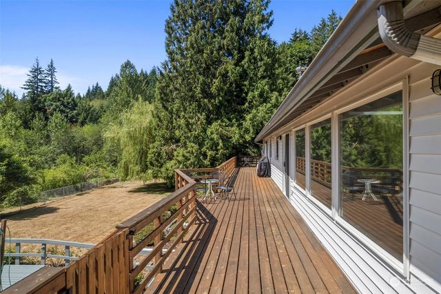 a view of balcony with wooden floor and outdoor space
