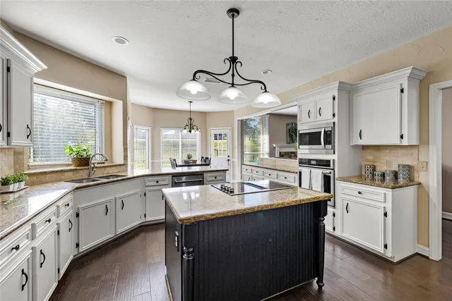 a view of room with window and wooden floor