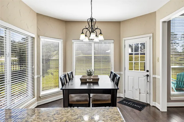 a bed room with a bed and a large window