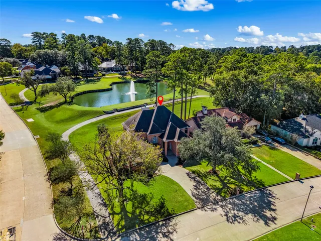 a front view of a house with a yard garage and outdoor seating