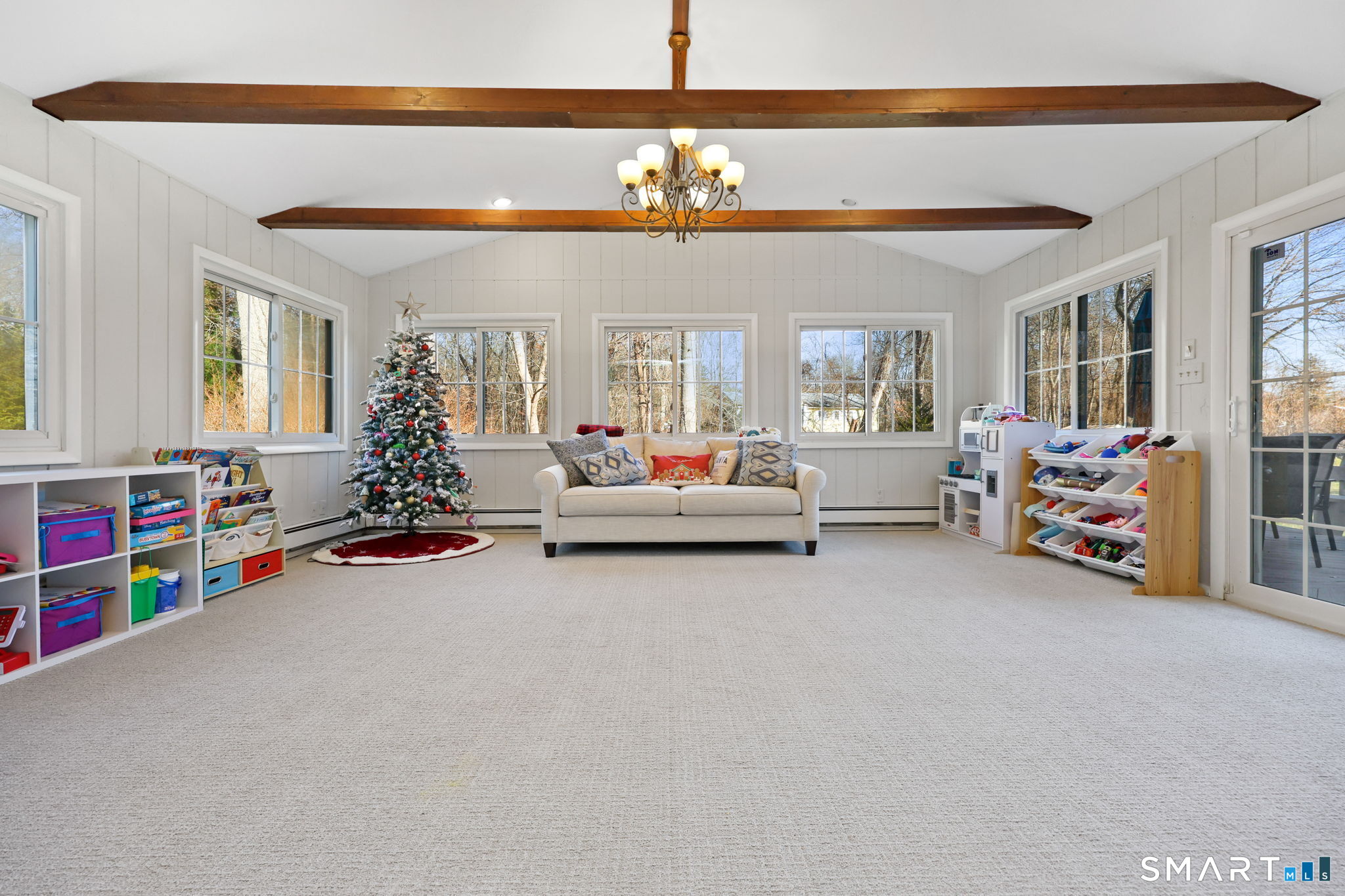 33 Purdy Road East Norwalk, CT 06850 - Photo 12 of 39 a living room with furniture and a chandelier