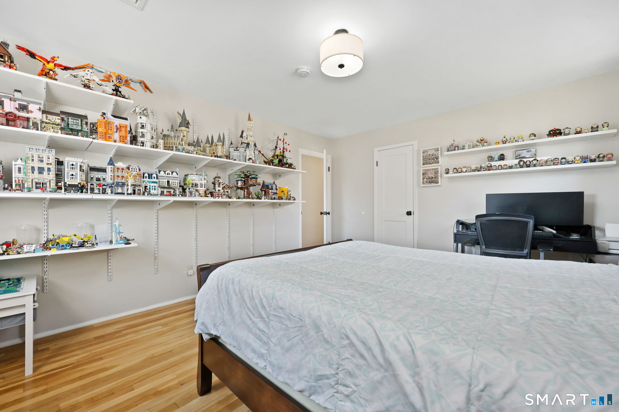 33 Purdy Road East Norwalk, CT 06850 - Photo 25 of 39 a bedroom with a bed and wooden floor