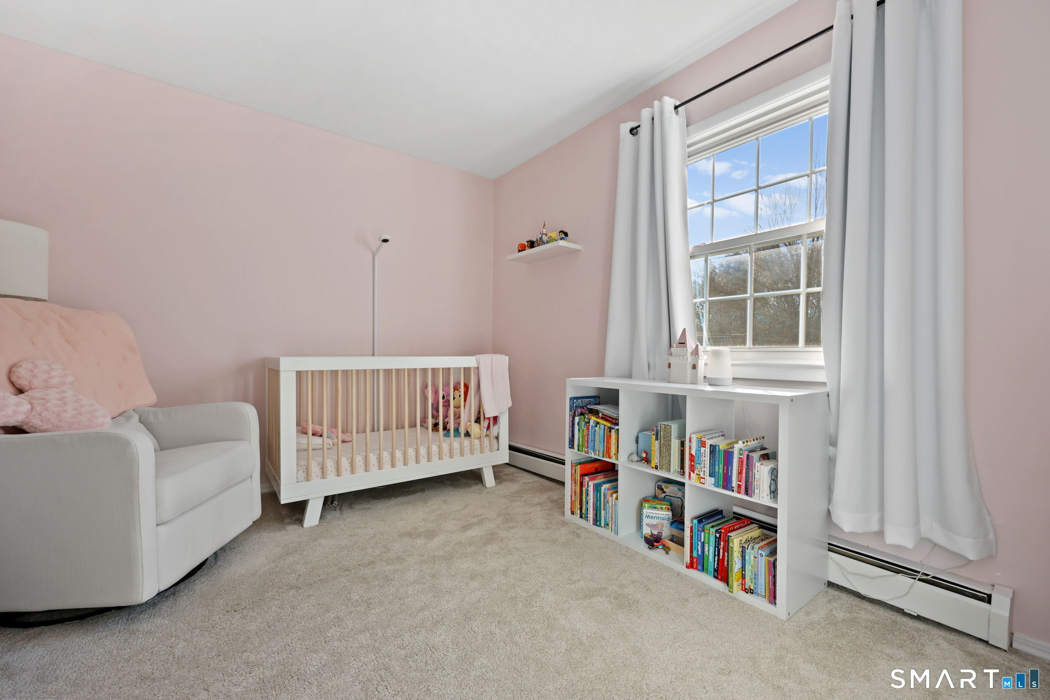 33 Purdy Road East Norwalk, CT 06850 - Photo 29 of 39 a bedroom with furniture and a book shelf