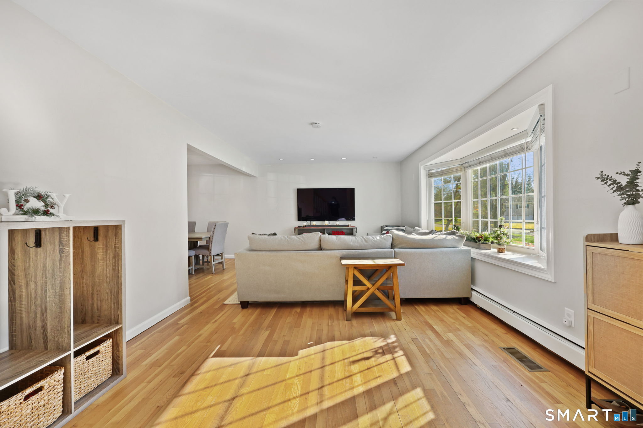 33 Purdy Road East Norwalk, CT 06850 - Photo 3 of 39 a living room with furniture wooden floor and a flat screen tv