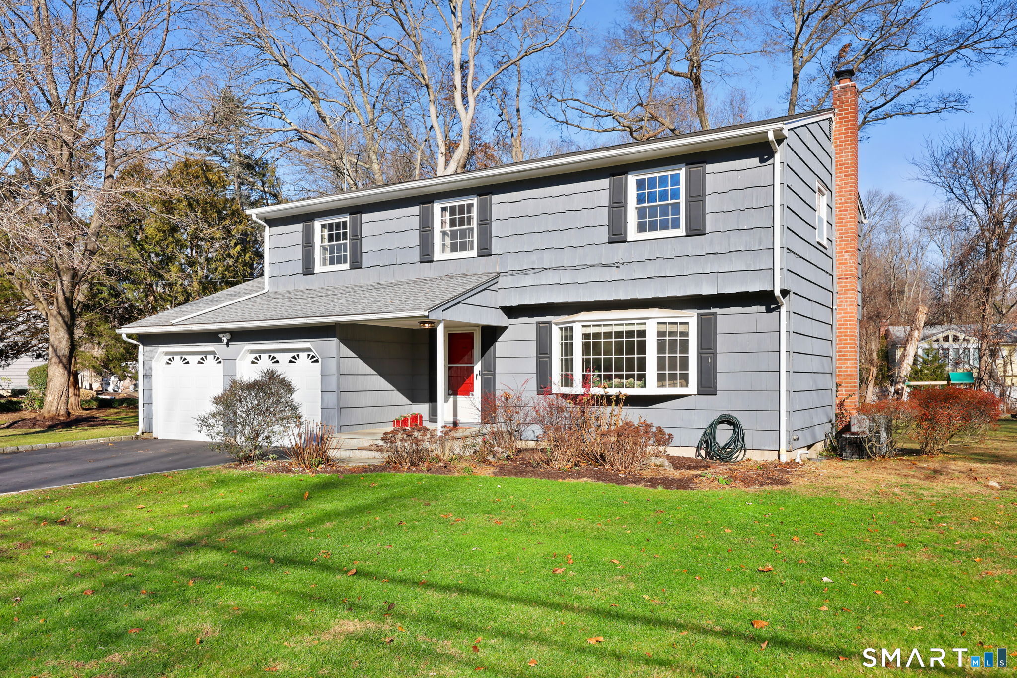 33 Purdy Road East Norwalk, CT 06850 - Photo 36 of 39 a front view of house with yard and outdoor seating