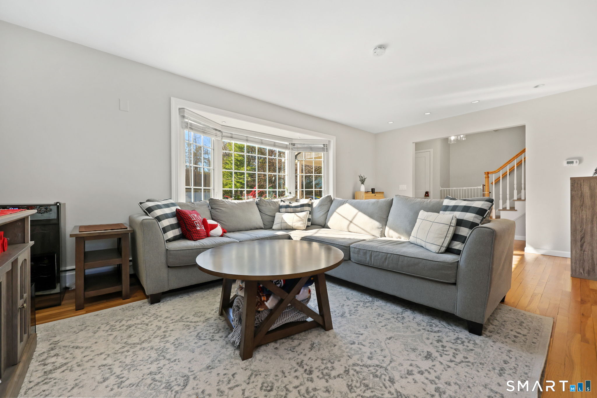 33 Purdy Road East Norwalk, CT 06850 - Photo 4 of 39 a living room with furniture a fireplace and a table