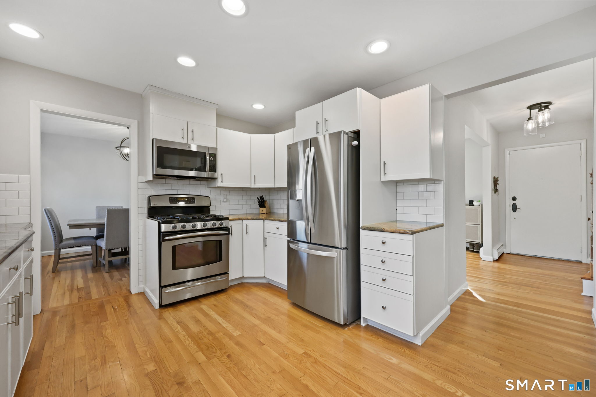 33 Purdy Road East Norwalk, CT 06850 - Photo 8 of 39 a kitchen with stainless steel appliances a refrigerator stove and microwave