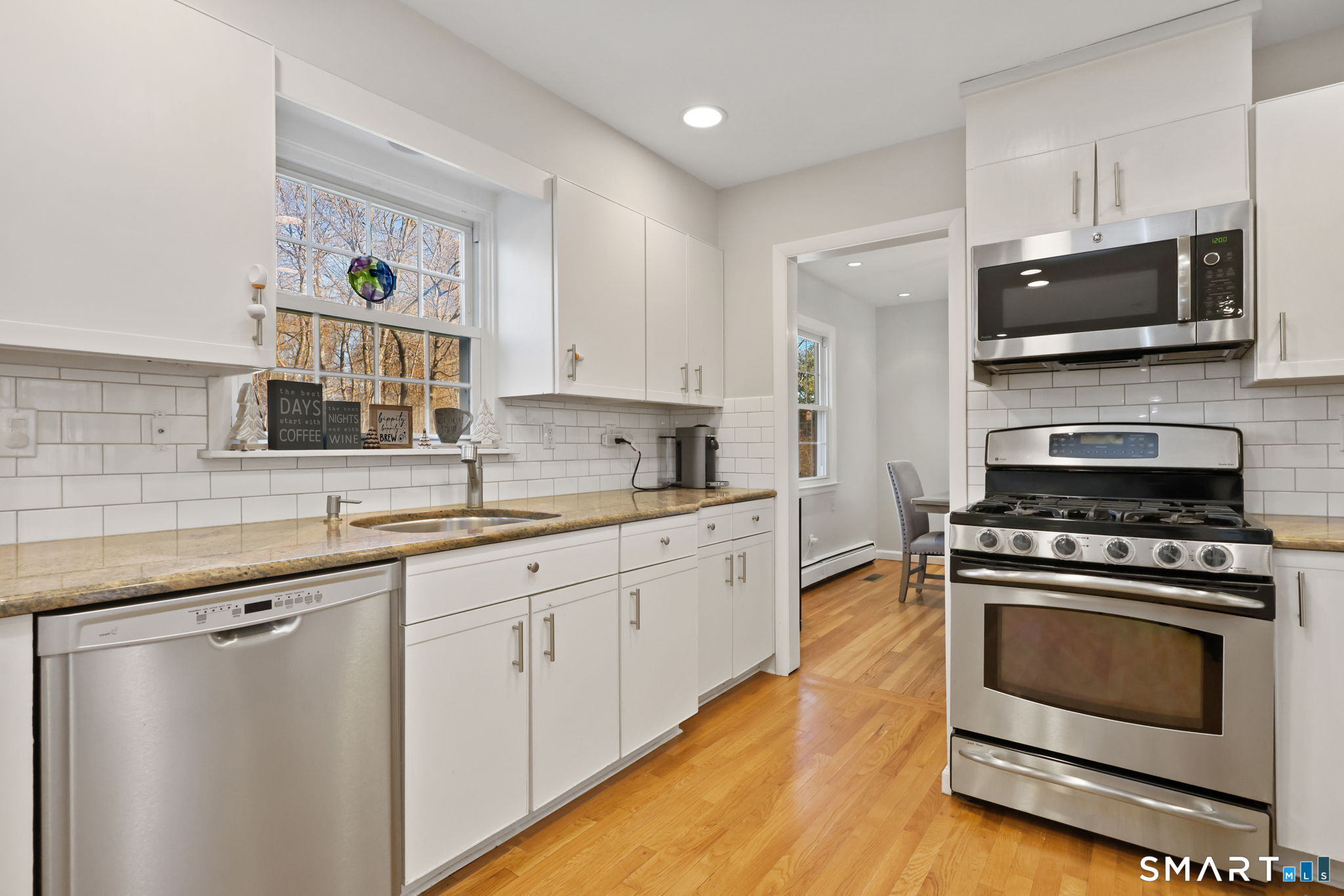 33 Purdy Road East Norwalk, CT 06850 - Photo 9 of 39 a kitchen with stainless steel appliances a stove a sink and a microwave