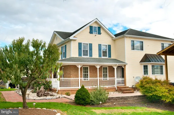 a front view of a residential apartment building with a yard