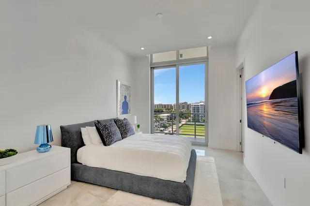 a bedroom with a bed and a television