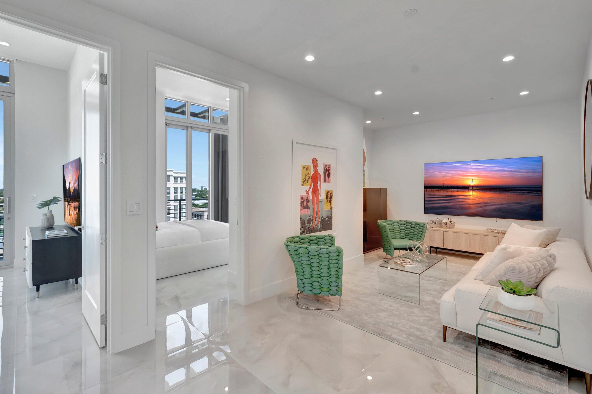 475 East Royal Palm Road, Unit PH 906 Boca Raton, FL 33432 - Photo 22 of 44 a living room with furniture and a flat screen tv