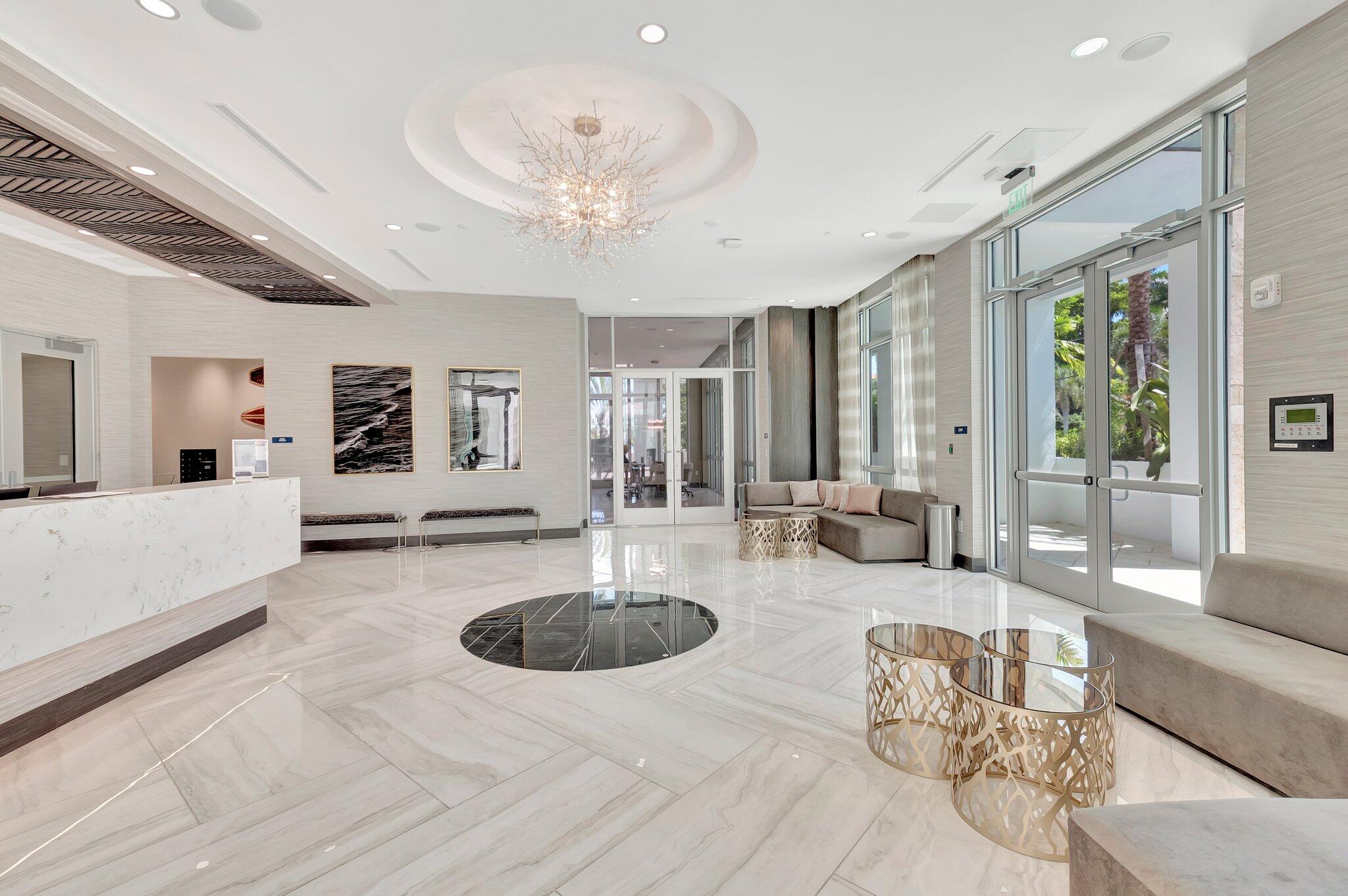 475 East Royal Palm Road, Unit PH 906 Boca Raton, FL 33432 - Photo 31 of 44 a living room with furniture and a table