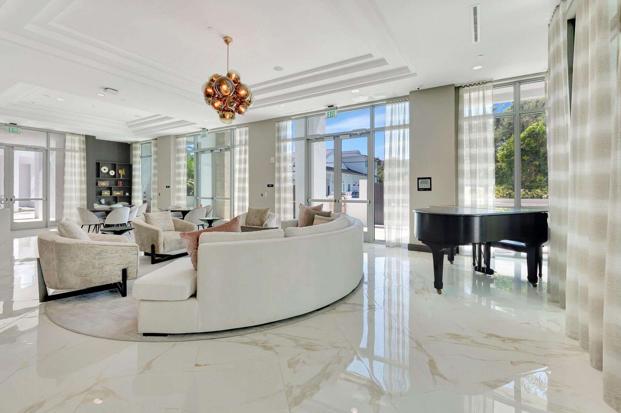 475 East Royal Palm Road, Unit PH 906 Boca Raton, FL 33432 - Photo 33 of 44 a living room with fireplace furniture and a large window