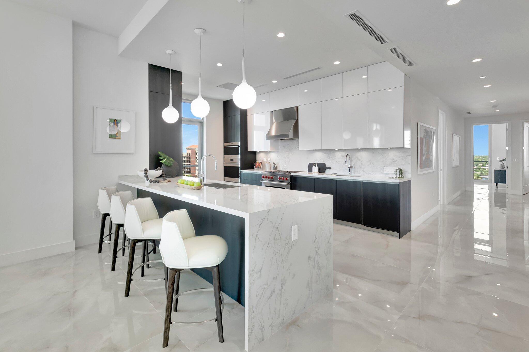 475 East Royal Palm Road, Unit PH 906 Boca Raton, FL 33432 - Photo 9 of 44 a kitchen with kitchen island stainless steel appliances a sink and a refrigerator