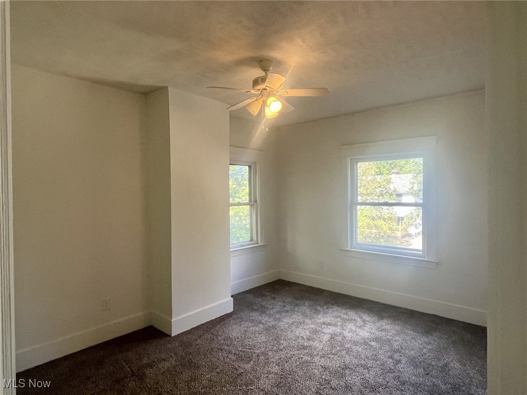 3264 Altamont Road Cleveland, OH 44118 - Photo 13 of 32 Bedroom featuring dark carpet, ceiling fan, and a textured ceiling