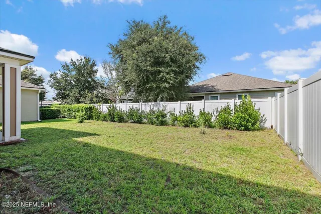 a view of a back yard of the house