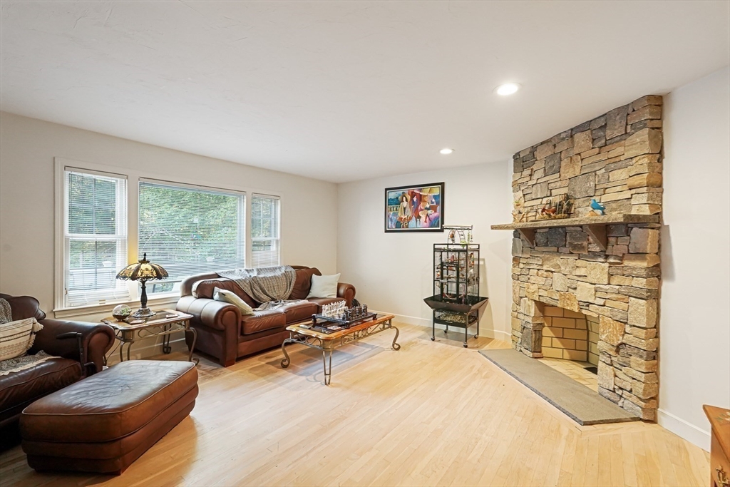 33 Woodstone Road Northborough, MA 01532 - Photo 13 of 42 a living room with furniture and a flat screen tv