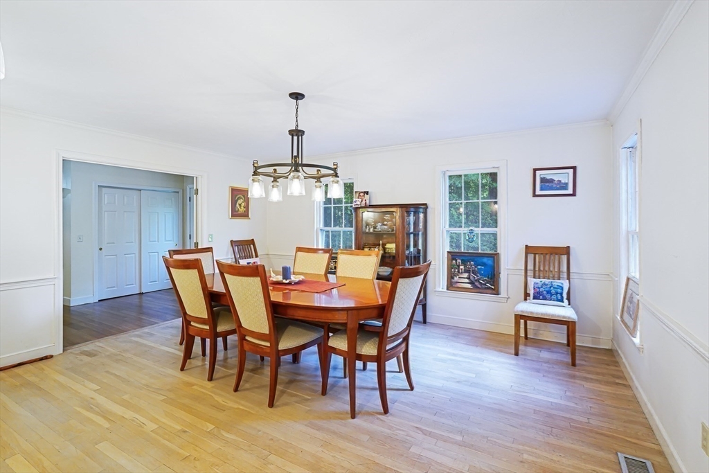 33 Woodstone Road Northborough, MA 01532 - Photo 18 of 42 a view of a dining room with furniture wooden floor and chandelier