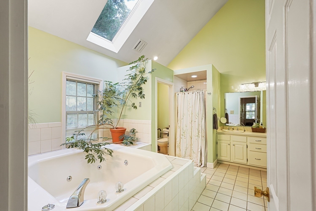 33 Woodstone Road Northborough, MA 01532 - Photo 23 of 42 a bathroom with a tub sink and mirror