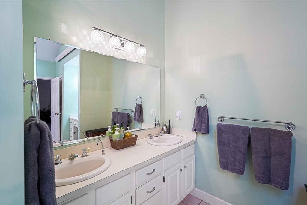33 Woodstone Road Northborough, MA 01532 - Photo 25 of 42 a bathroom with a sink and a mirror
