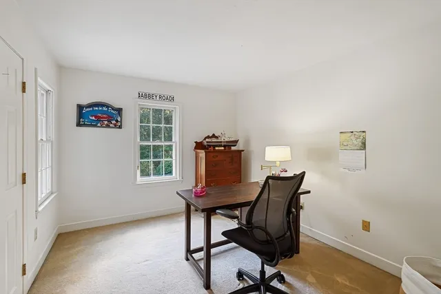 a workspace with furniture and a window